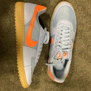 Brand new never worn Nike Blue and Orange Sneakers with Retro-Inspired Design